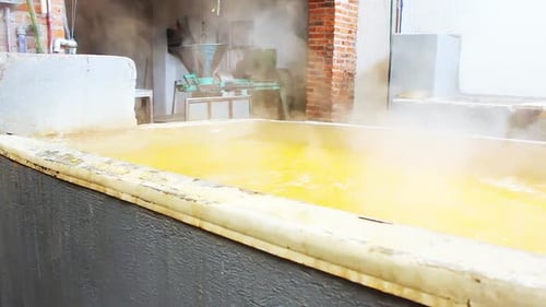 Industrial Process Featuring Steam and Yellow Liquid