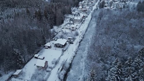 A Snowy Winter Landscape Aerial View of a Serene and Peaceful Village Surrounded By White Snow and