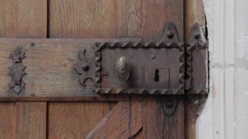 Antique Wooden Door with Jagged Metal Lock