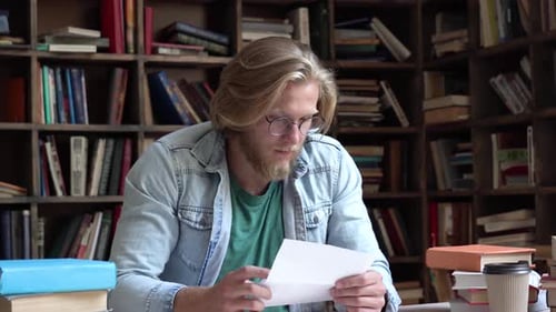Overjoyed university student receives admission letter with scholarship victory concept