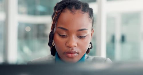 Focused Woman Working at Computer in Modern Office