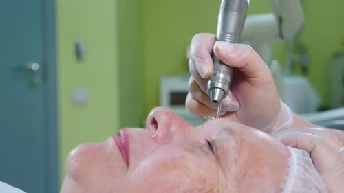 Woman Receives Medical Treatment on Face