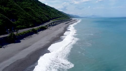 Highway by the sea and beautiful waves in a tropical country