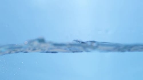 Gentle Water Waves Rippling on Light Blue Surface