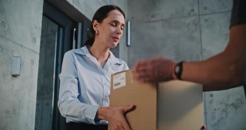 Postman Delivering Parcel Box for Recipient Businesswoman Signing POD on Tablet Computer