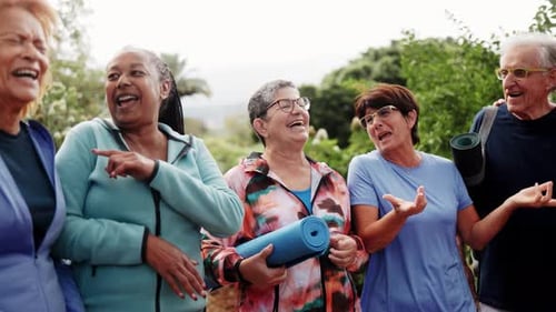 Happy Seniors Talking and Laughing Together Outdoors