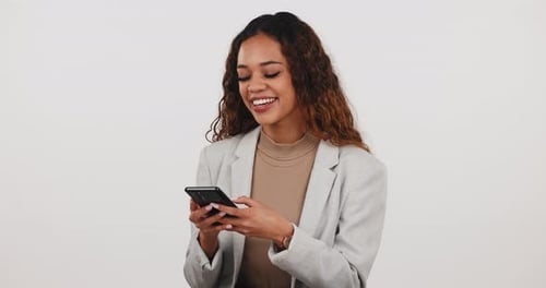 Phone, comic and happy woman laugh in studio at funny, joke or silly text message on white