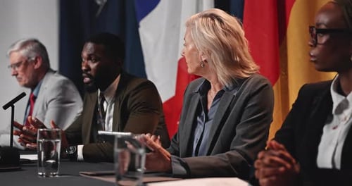 Business Professionals at Formal International Conference with Flags