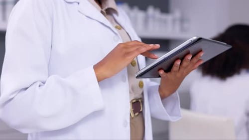 Doctor Uses Tablet in Modern Medical Workplace