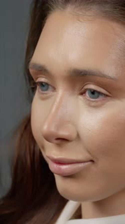 Woman Having Makeup Applied in Studio, Close Up