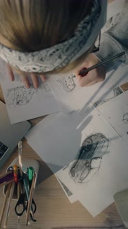 Young Woman Artist Draws Pencil Sketches Works on Storyboard of a Comic Top View