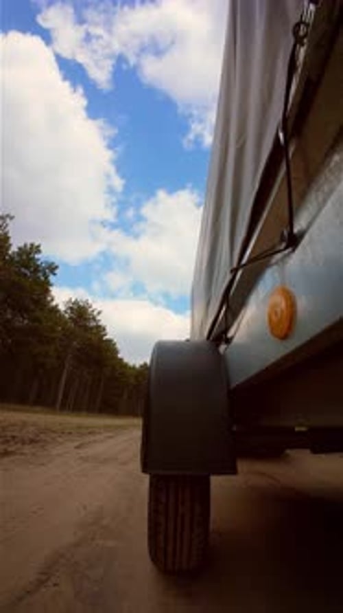 Cargo Delivering on Trailer Pick Up Truck with Dirty Wheels Car Driving on Sandy Road Vertical