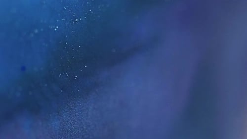 Flowing Blue Hues and Shimmering Particles