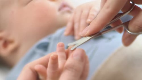 Baby Fingernails Trimmed with Nail Scissors, Close Up