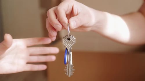 Estate Agent Hand Over the Keys to the Owner