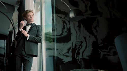 Young Businessman in a the Hotel Room Action Young Attractive Man in Black Suit Standing Indoors and