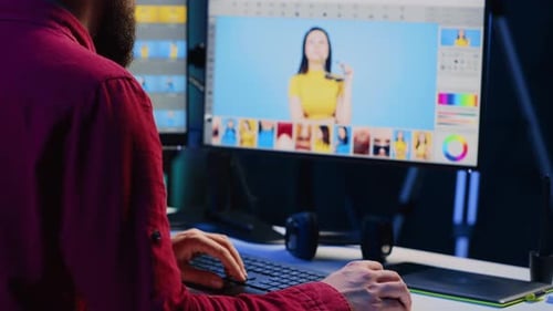 Young Man Editing a Photo at His Desk