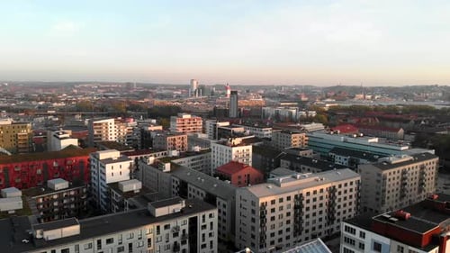 Aerial ascending view Hisingen cityscape horizon, tranquil urban scene, Hisingen, Gothenburg
