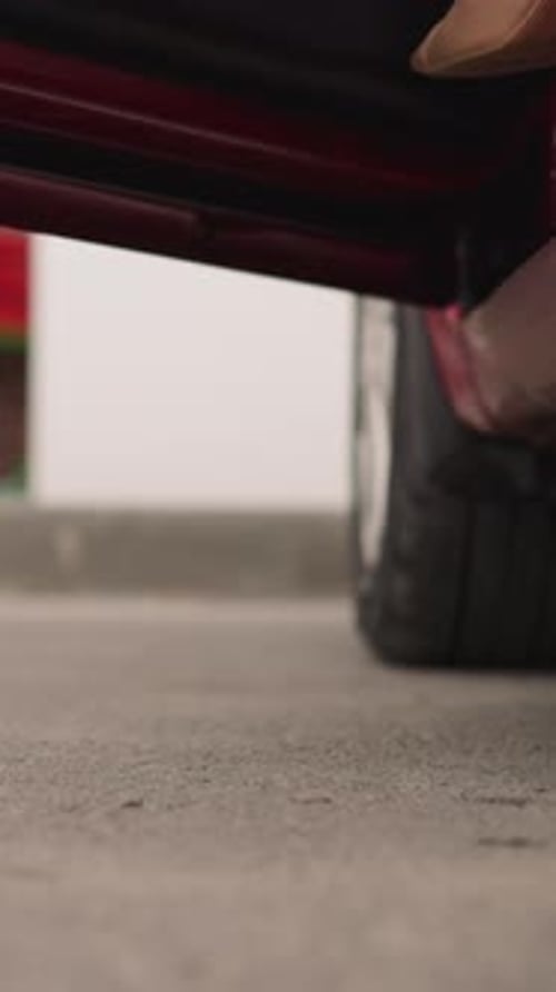 Elegant Woman Exiting Car Showing Off High Heels
