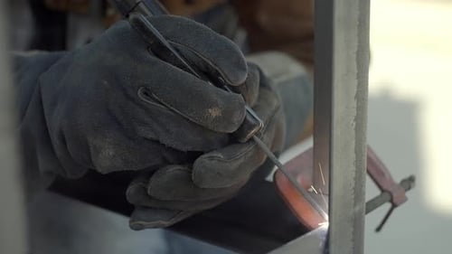 Stick Welding Slow Motion, Close Up Of Gloved Hands Holding Welder
