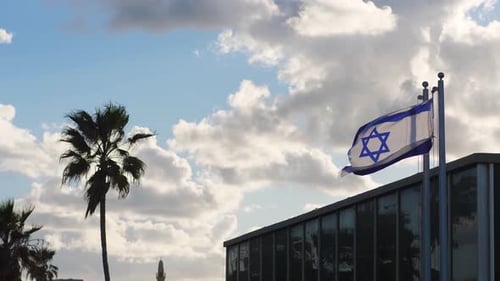 Israeli Flag Waving in the Wind in Daytime