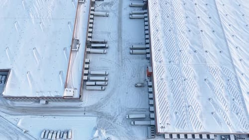 Aerial View of Snow-Covered Industrial Warehouse Complex