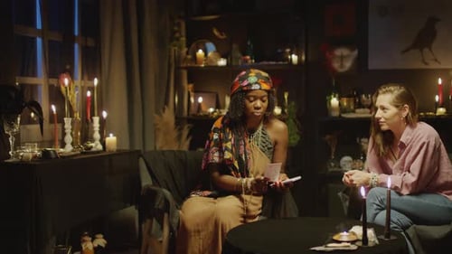 Fortune Teller Predicting Clients Future with Tarot Cards
