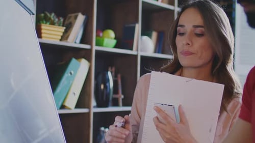 Woman and Man Working Together in an Office