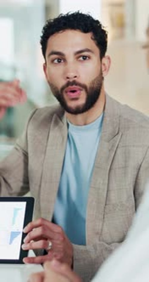 Corporate, man and meeting with graphs on tablet for accounting, data analysis and annual report