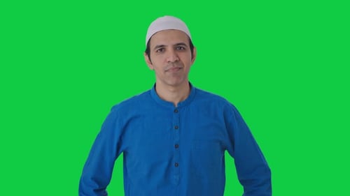 Confused Muslim man asking What question Green screen