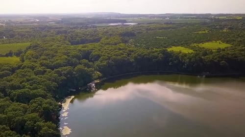 Aerial shot of forest reserve and lake