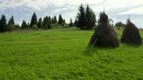 Mountains Landscape with Straw in Sheafs