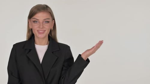 Blonde Woman Smiling and Presenting on White Background