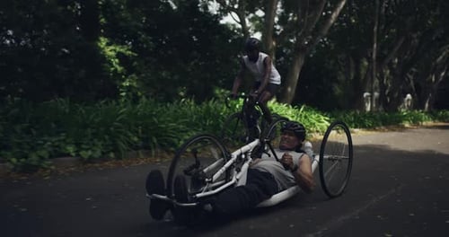 Man Riding Recumbent Bike with Cycling Companion