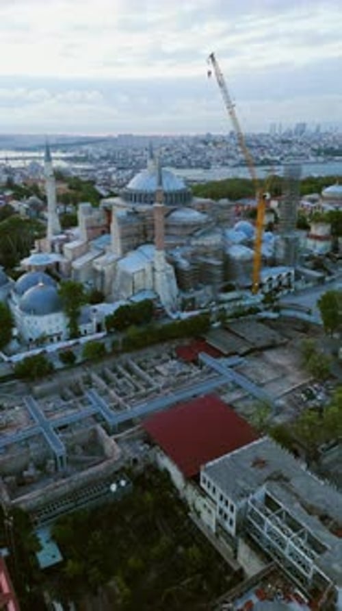 Vertical drone shot rising toward the Hagia Sofia grand Mosque, dusk in Istanbul