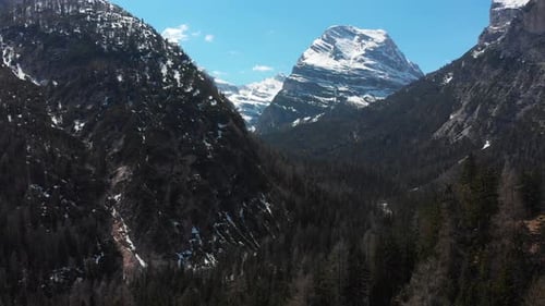 A Landscape of Mountains with Snowy Summits and the Green
