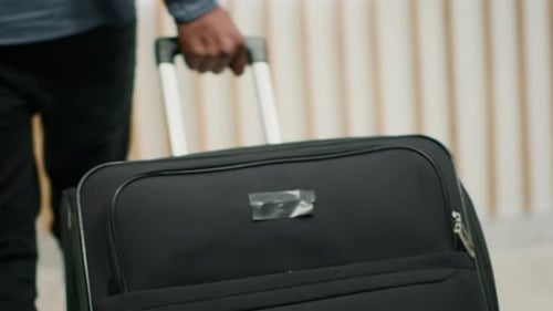 Tourist Arriving with Luggage at Hotel