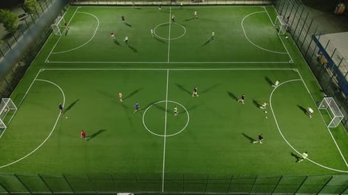 Aerial View of a Mini Football Match Soccer MiniFootball Field and Footballers From Drone