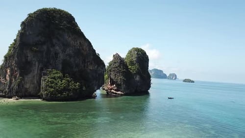 Cinematic Aerial View on Exotic Tropical Paradise Scenery of Thailand. White Sand Beach and Steep Li