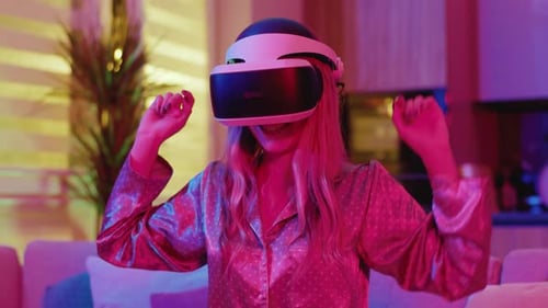 Woman Wearing VR Headset Plays Game Indoors