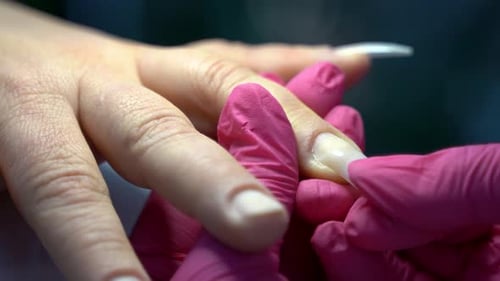 Close up of beautiful female hands manicure treatment in beauty salon 4K