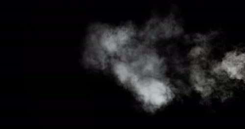 White Smoke Puffs on Black Background for Compositing