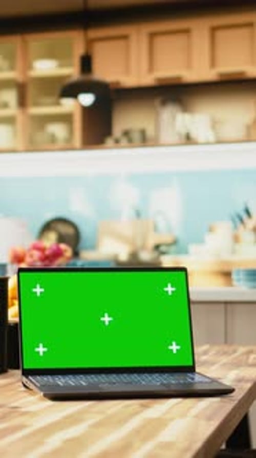 Vertical Video Green Screen Laptop on Wooden Table in Empty Bright Kitchen