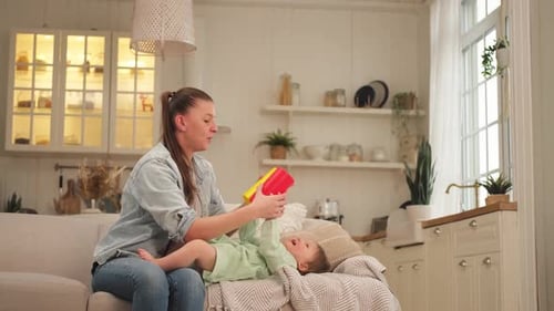 Mother and Child Play with Stacking Cups