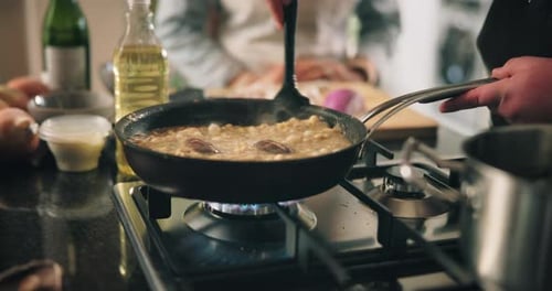 Cooking food in a pan on a stove