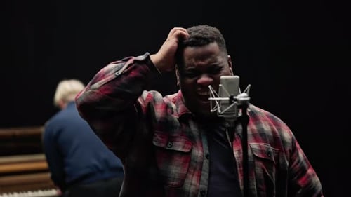 Focused Singer Performs in Studio