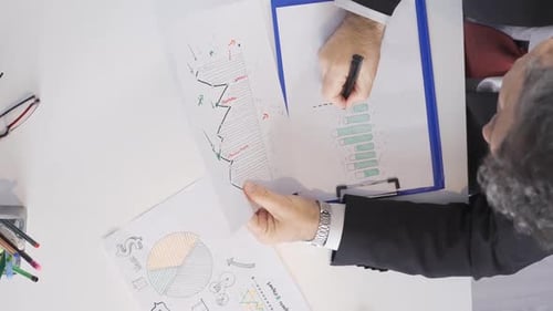 Vertical Video of Businessman working on statistical data. Analysis of financial charts.