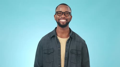 Happy, smile and face of black man in a studio with confident, good and positive attitude