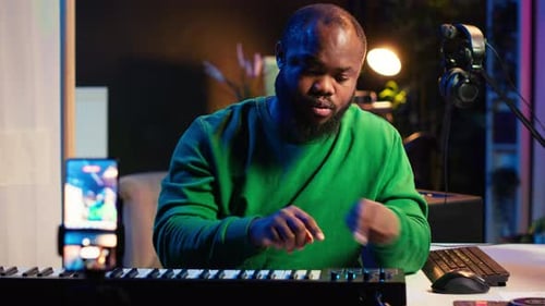 Male Musician Plays Electric Piano At Home