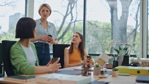 Team Discussing Business Strategy in Modern Office